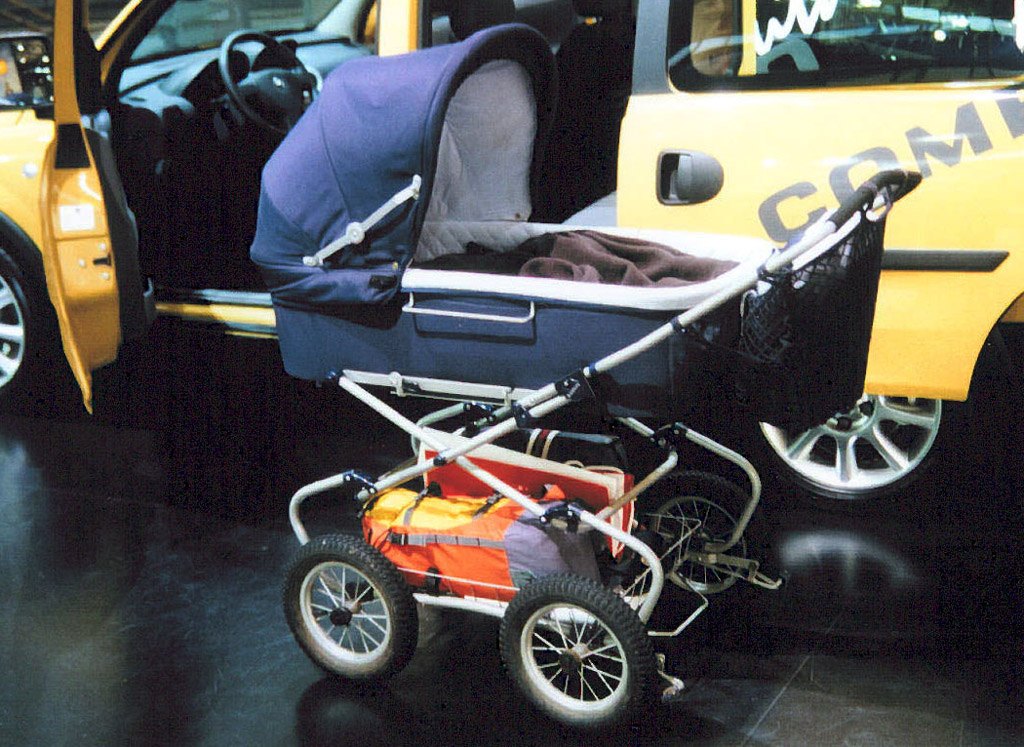 A pram showing its frame and wheels, illustrating the equipment involved.