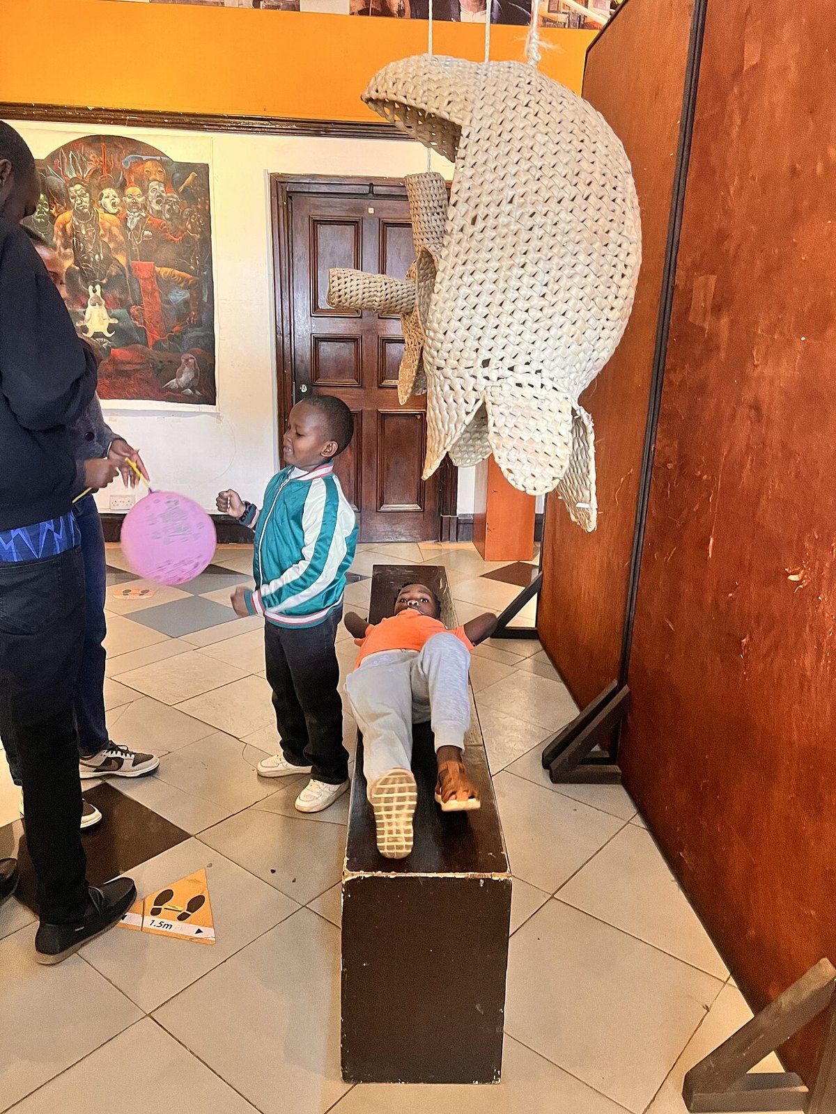 Children in a museum gallery in Kenya, illustrating shared discovery.